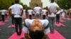 People take part in a yoga session at Lodhi gardens on International Day of Yoga, in New Delhi.