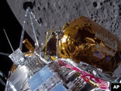 This image provided by Intuitive Machines shows its Odysseus lunar lander over the near side of the moon following lunar orbit insertion, Feb. 21, 2024. The lander guided itself to the surface Feb. 22.