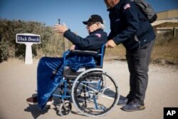 US veteran arrives at a commemoration at Utah Beach near Sainte-Marie-du-Mont, Normandy, France, June 4, 2023.