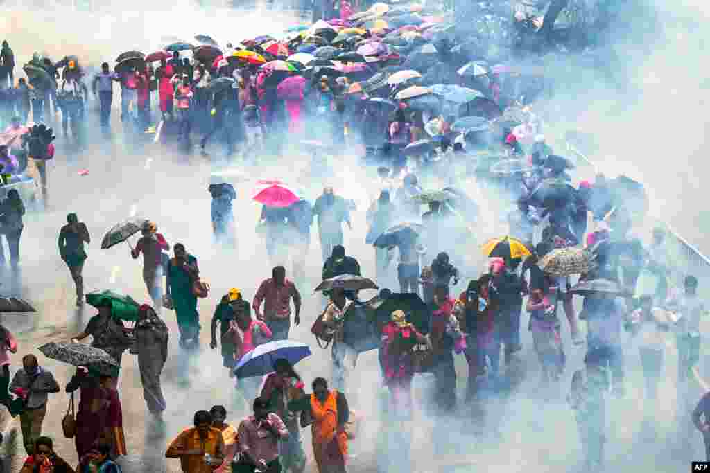 Police use water cannons and tear gas to disperse teachers and principals protesting against salary anomalies during an anti-government demonstration in Colombo, Sri Lanka.