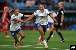 England's Lauren James, right, celebrates a first half goal with teammate England's Ella Toone during the Women's World Cup Group D soccer match between England and Denmark at Sydney Football Stadium in Sydney, Australia, Friday, July 28, 2023.