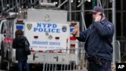 New York Police Department officers of the emergency service unit arrive at the courthouse after powder in an envelope meant for the district attorney's office was found, March 24, 2023, in New York.
