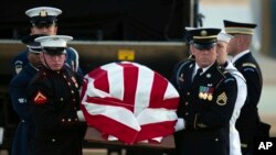 An armed forces color guard carries a casket containing the body of US Sen. Dianne Feinstein at San Francisco International Airport, Sept. 30, 2023, in San Francisco. 
