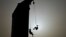 Silhouettes of climbers hanging on ropes after competing in the women's speed sport climbing qualification at the 2024 Olympic Qualifier Series held in Budapest, Hungary, June 22, 2024.