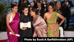 Payal Kapadia in black, wins the grand prize for 'All We Imagine as Light,' with Divya Prabha, Chhaya Kadam and Kani Kusruti at the 77th international film festival, Cannes, France, May 25, 2024.