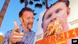 FILE - Morgan Spurlock poses at the Los Angeles premiere of his film "Super Size Me," in the Hollywood section of Los Angeles, April 22, 2004.