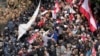 Retired army soldiers and other protesters who are demanding better pay, clashes with Lebanese army and riot police, in Beirut, Lebanon, March 22, 2023. 