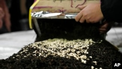 FILE - Confiscated captagon pills that were hidden in 434 boxes mixed with seven tons of tea for export are put on display at police headquarters in Beirut, Lebanon, Jan. 25, 2022.