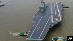 中國第三艘航空母艦“福建號”2024年5月1日從上海江南造船廠出發首次海試。