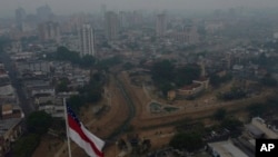 Smoke from wildfires fills the air during a drought in Manaus, Amazonas state, Brazil, Oct. 12, 2023. 