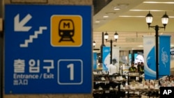 Police officers cordon off the scene near a subway station in Seongnam, South Korea, Aug. 3, 2023.
