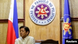 FILE - Philippine President Ferdinand Marcos Jr. looks on as he meets with US Secretary of State Antony Blinken, at Malacanang Palace in Manila, Philippines, March 19, 2024. 