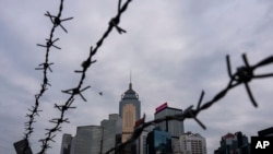 资料图：香港立法会全票通过根据《基本法》第23条订立的新的国家安全法案当天的香港金融区景色。(2024年3月19日)