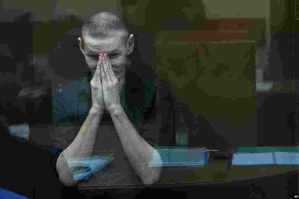 U.S. citizen Robert Woodland sits in a glass cage prior to a court session on drug-related charges in Moscow, Russia. Woodland was arrested on drug charges in January and faces up to 20 years in prison if convicted.