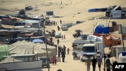 在加沙地帶拉法城帳篷中居住的巴勒斯坦難民在加沙地帶拉法城帳篷中居住的巴勒斯坦難民。 （2024年5月31日）