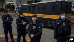 资料照片: 2023年12月1日一辆载着黎智英的装甲囚车离开西九龙裁判法院