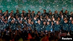 2024年1月13日，台灣當選總統賴清德和他的競選夥伴蕭美琴在台北參加總統選舉勝利後的集會。 (路透社）