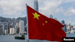 資料照：香港金融區與中國國旗