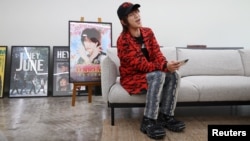 Tanaka, whose real name is Kim Kyung-wook, sings a song during an interview with Reuters in Seoul, South Korea, May 16, 2023. The comedian's Japanese-inspired character has made him one of South Korea's hottest YouTube stars. 