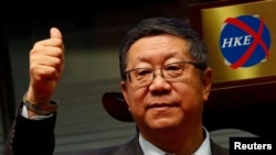 中國光大集團前董事長唐雙寧在香港交易所參加光大上市活動。（2013年12月20日）