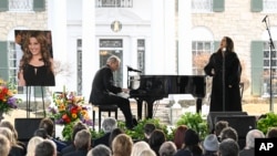 Alanis Morissette, right, and Mike Farrell perform during a memorial service for Lisa Marie Presley, in Memphis, Tennessee, Jan. 22, 2023.