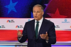 FILE - Jay Inslee speaks during the first Democratic primary debate of the 2020 presidential campaign season at the Adrienne Arsht Center for the Performing Arts in Miami, June 26, 2019.
