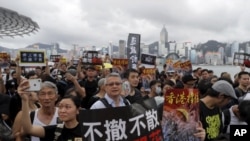 香港7月7日繼續爆發大規模遊行，爭取中國遊客支持。圖片來源：美聯社