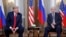 FILE - U.S. President Donald Trump, left, and Russian President Vladimir Putin, right, listen to the media in Helsinki, Finland, July 16, 2018. Trump said on Tuesday he would likely impose sanctions on Russia if Putin refuses to negotiate about ending the war in Ukraine. 