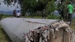 調查人員研判一片殘骸是否屬於馬航失蹤客機