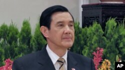 A woman is rescued from flood waters by a resident standing on top of her car during heavy rain in Chalandri suburb north of Athens, Greece.<br />
