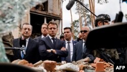 2022年6月16日，法国总统马克龙（Emmanuel Macron）、德国总理舒尔茨（Olaf Scholz）、意大利总理德拉吉（Mario Draghi）以及罗马尼亚总统约翰尼斯（Klaus Iohannis）访问乌克兰基辅后来到基辅东北郊的伊尔平镇。