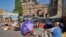 FILE - In this photo taken on Friday, July 26, 2019, teenage climate campaigners sit outside Swedish parliament in Stockholm. 