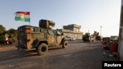 资料照片：伊拉克军队在基尔库克市郊外加紧部署，试图夺回伊斯兰国一天前占领的村庄（2021年12月6日）