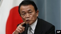 日本副首相麻生太郎12月26日在东京