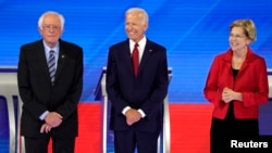 Senator Bernie Sanders joins former Vice President Joe Biden and Senator Elizabeth Warren onstage before the start at the 2020 Democratic U.S. presidential debate in Houston, Sept. 12, 2019. 
