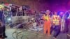 Rescue personnel work to retrieve casualties from an overturned bus, after it lost control and fell into a ditch during its journey from Bueng Kan to Rayong, in Prachinburi province, Thailand, Feb. 26, 2025. (Prachinburi Highway District /Handout via REUTERS)