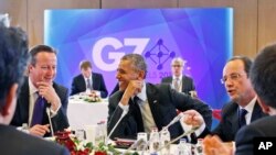 6月5日美国总统奥巴马和英国首相卡梅伦（左）在布鲁塞尔参加七国会议