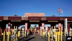 FILE - The border crossing sits closed Dec. 15, 2023, at Lukeville, Ariz. U.S. authorities say the crossing on the most direct route from Phoenix to the nearest beaches will reopen Jan. 4, 2024, one month after it closed in response to a large migrant influx. 