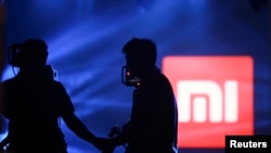 北京一次小米平板电脑发布会上展示的小米标识。（2014年5月15日）