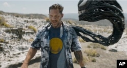 ພາບຕອນນຶ່ງຂອງຮູບເງົາ ຈາກບໍລິສັດ Sony Pictures ສະແດງໃຫ້ເຫັນ ທອມ ຮາຣດີ ໃນບົດນຳຊາຍເລື້ອງ Venom: ຕອນ The Last Dance