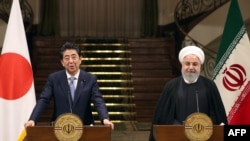 伊朗總統魯哈尼6月12日在德黑蘭與日本首相安倍晉三舉行聯合記者會。