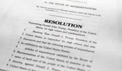 ,A copy of a page of the Articles of Impeachment is seen in Washington, Dec. 10, 2019.