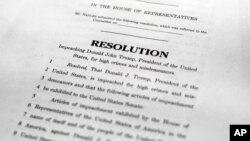 ,A copy of a page of the Articles of Impeachment is seen in Washington, Dec. 10, 2019. 