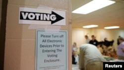 Afghan laborers polish metal pots at an aluminum factory in Herat.