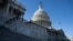 FILE - A U.S. flag flies near the dome of the U.S. Capitol in Washington, Feb. 25, 2025. 