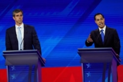 Former Texas Rep. Beto O'Rourke, left, listens as former Housing and Urban Development Secretary Julian Castro, right, responds to a question, Sept. 12, 2019, during a Democratic presidential primary debate at Texas Southern University in Houston.…