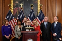 House Judiciary Committee Chairman Jerrold Nadler, D-N.Y., center, unveils articles of impeachment against President Donald Trump, during a news conference on Capitol Hill in Washington, Dec. 10, 2019.