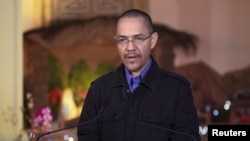 委內瑞拉新聞和通信部長維萊格斯在記者會上宣佈查韋斯總統症手術後出現併發症