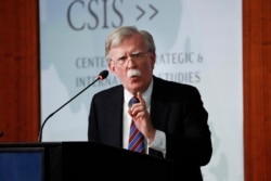 Former National Security Adviser John Bolton gestures while speaking at the Center for Strategic and International Studies in Washington, Sept. 30, 2019.