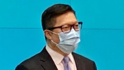 警務處處長鄧炳強升任保安局局長，首位警察背景升任政務司司長的李家超，被香港傳媒形容為”警察政府”。 (美國之音湯惠芸）